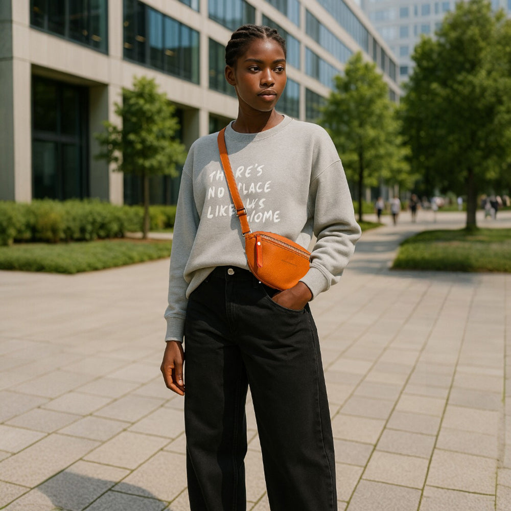 RB1015L | Waist bag with removable shoulder strap in Genuine Leather Made in Italy. Attachments with shiny nickel metal snap hooks - Orange color - Dimensions: 24 x 14 x 7
