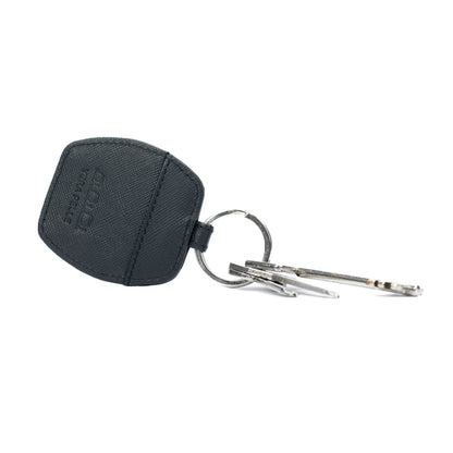 K10854AB | Genuine Saffiano Leather Keyring. Black colour. Polished Nickel key ring. Total dimensions: 5.5 x 9.5 x 0.5 cm. Packaging: Rigid bottom/lid gift box