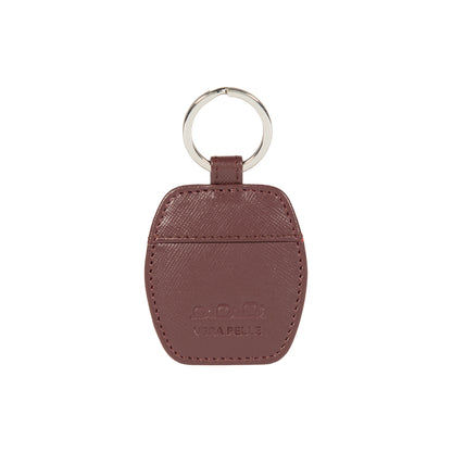 K10854XB | Genuine Saffiano Leather Keyring. Bordeaux color. Polished Nickel key ring. Total dimensions: 5.5 x 9.5 x 0.5 cm. Packaging: Rigid bottom/lid gift box