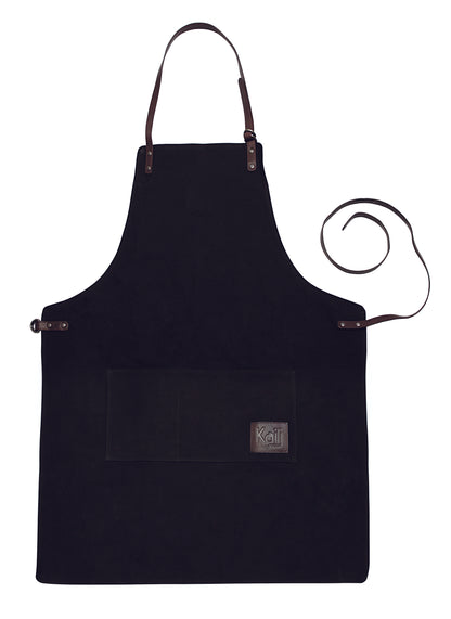 K0015AB | Work Apron in Canvas/Genuine Full Grain Leather, flywheel. Color Black/Dark Brown. Antique Nickel Accessories. Dimensions: 70 x 90 x 0.5 cm. Packaging: Polybag