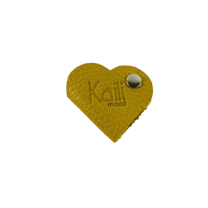 K0039RB | Heart cable winder Made in Italy in genuine full grain leather, dollar grain - Yellow color - Dimensions: 5 x 8 x 0.5 cm - Packaging: Rigid bottom/lid gift box